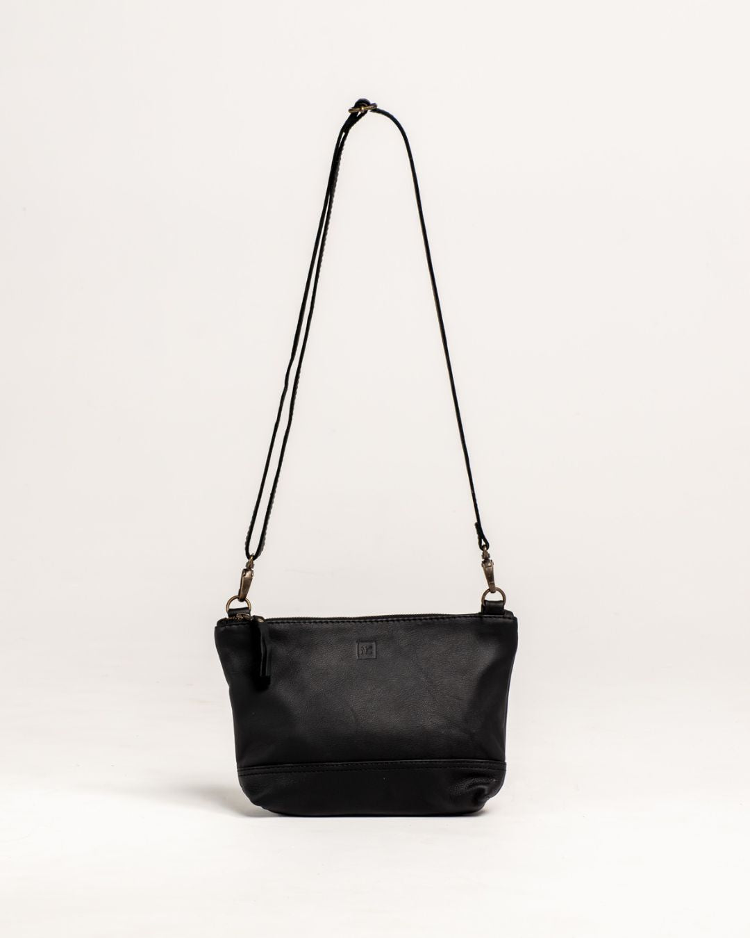 Ngozi Collection black leather sling bag with adjustable strap