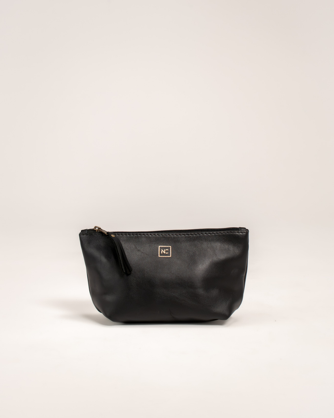 Ngozi Collection black leather makeup bag with zipper pull