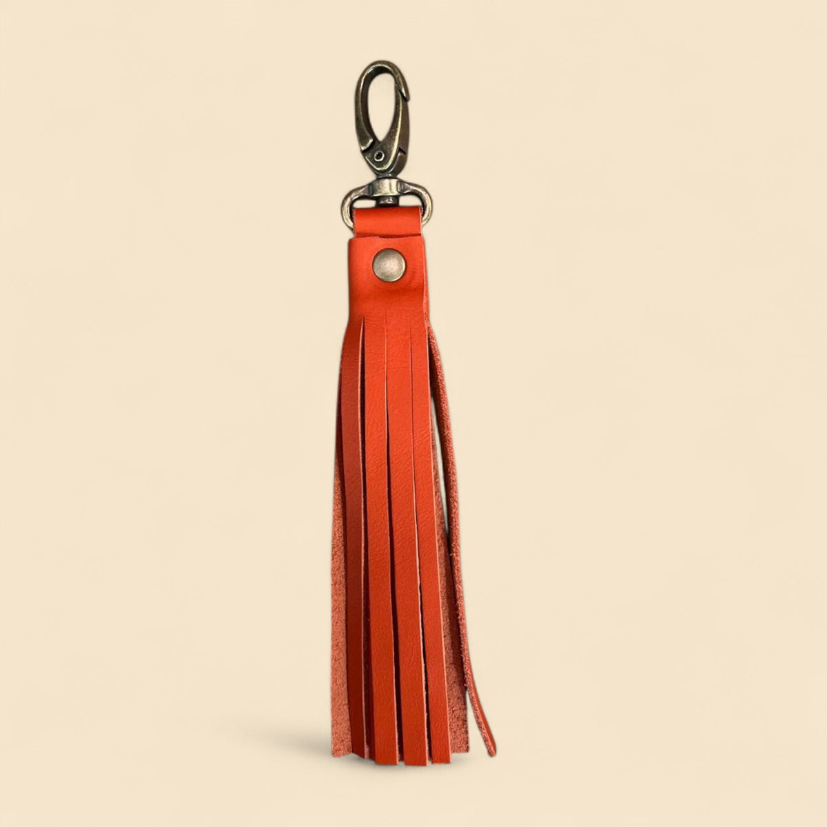 Ngozi Collection coral leather tassel keyring