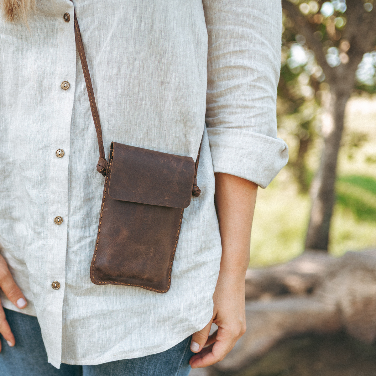 Ngozi Collection Chocolate leather cellphone sling worn crossbody
