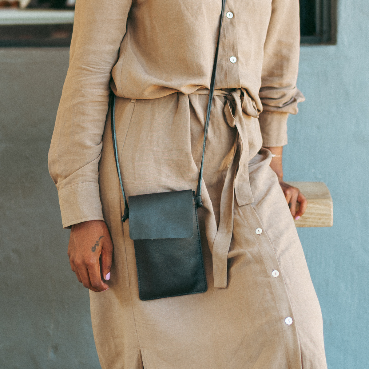 Ngozi Collection Black leather cellphone sling worn crossbody
