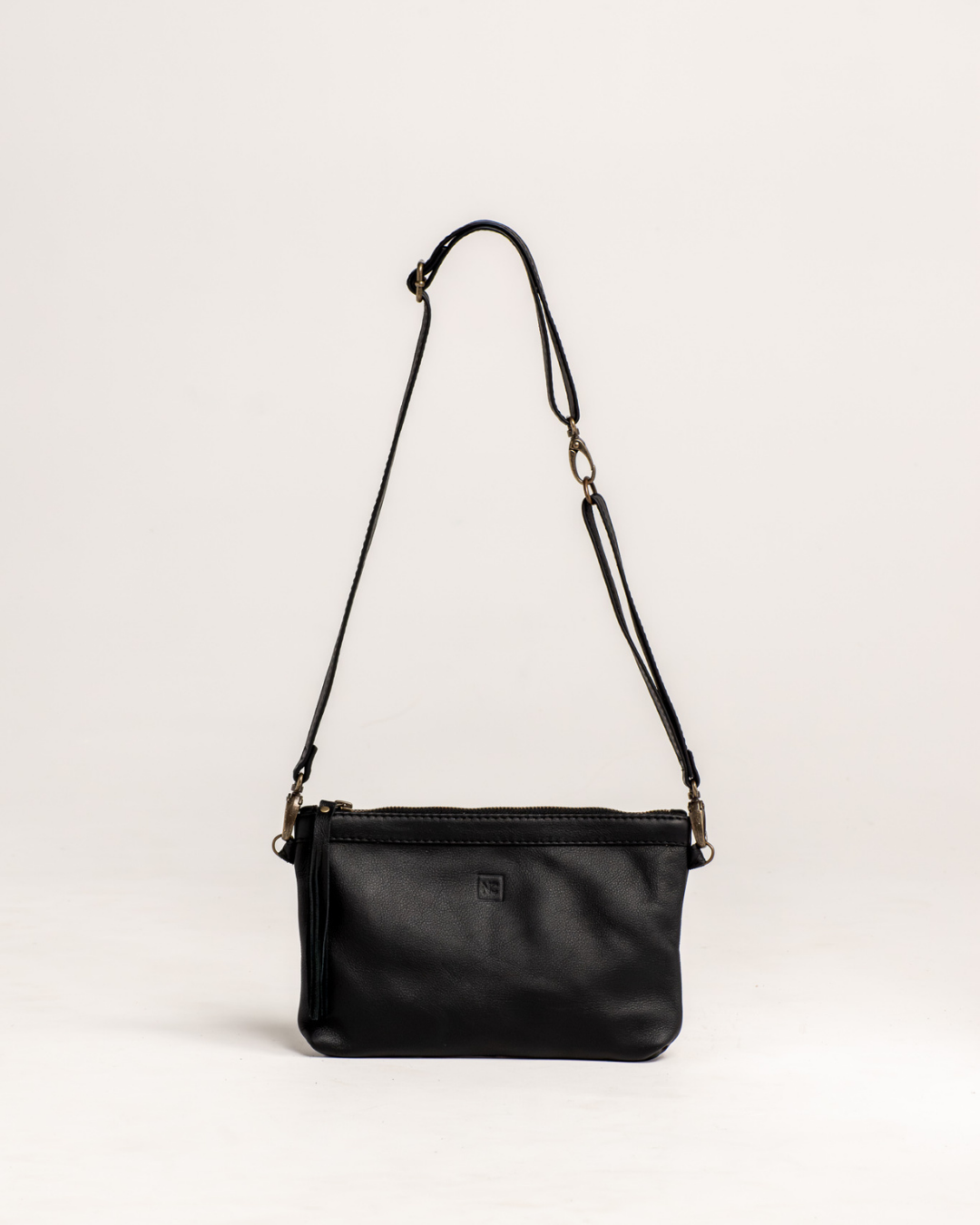 Ngozi Collection black leather sling bag