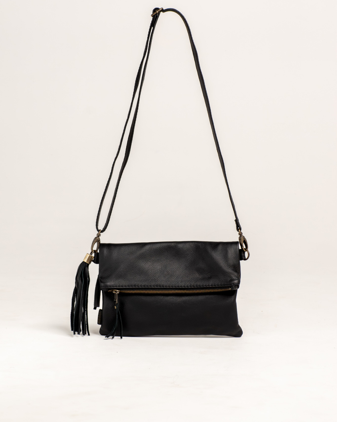 Ngozi Collection black leather clutch and sling bag