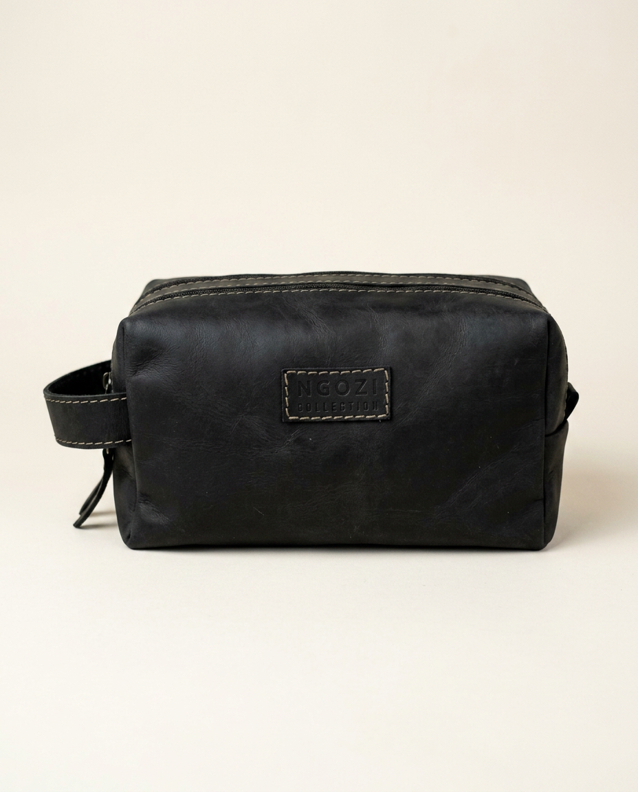 Ngozi Collection black leather toiletry bag with zip closure and side handle