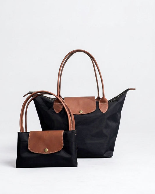 Ngozi Collection black nylon foldable shopper tote shown folded and open