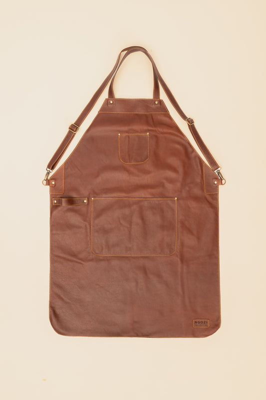 Ngozi Collection chocolate leather apron with cross-back straps and front pockets