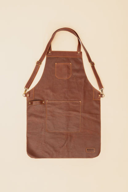 Ngozi Collection chocolate leather apron showing antique brass fittings