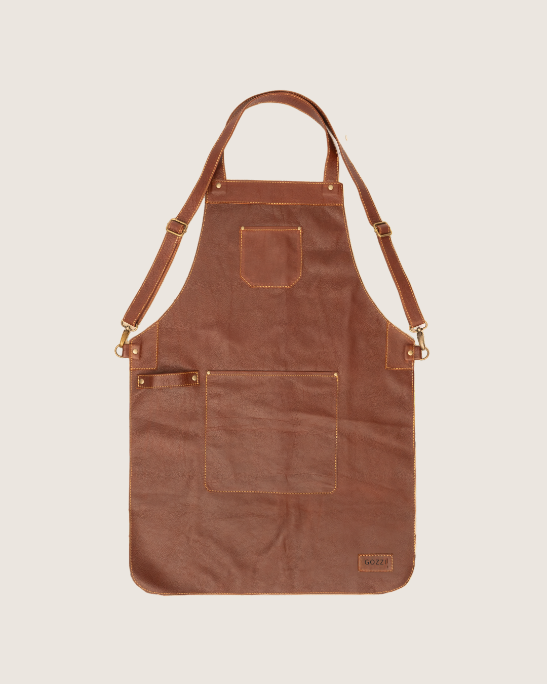 Ngozi Collection chocolate leather apron in small with cross-back straps and front pockets