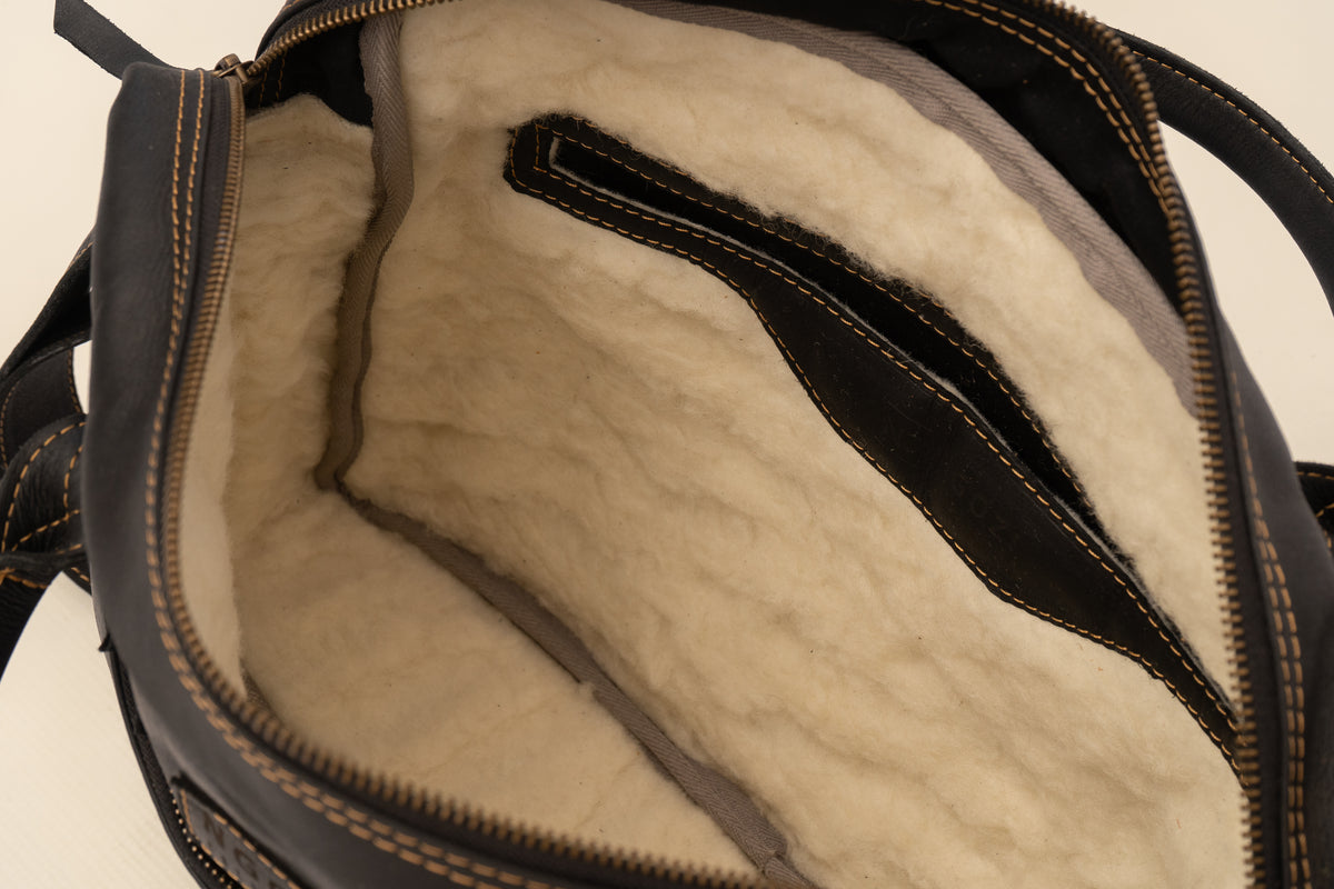 Ngozi Collection chocolate leather laptop bag open, showing padded interior