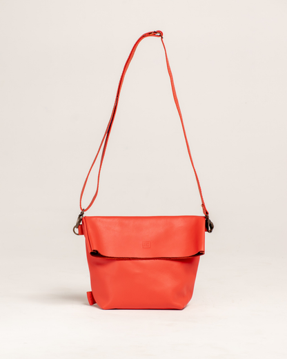 Ngozi Collection coral leather unlined foldover bag