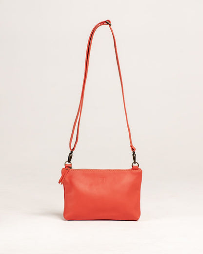 Ngozi Collection coral leather sling bag with adjustable strap