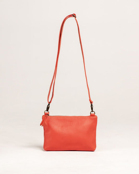 Ngozi Collection coral leather sling bag with adjustable strap