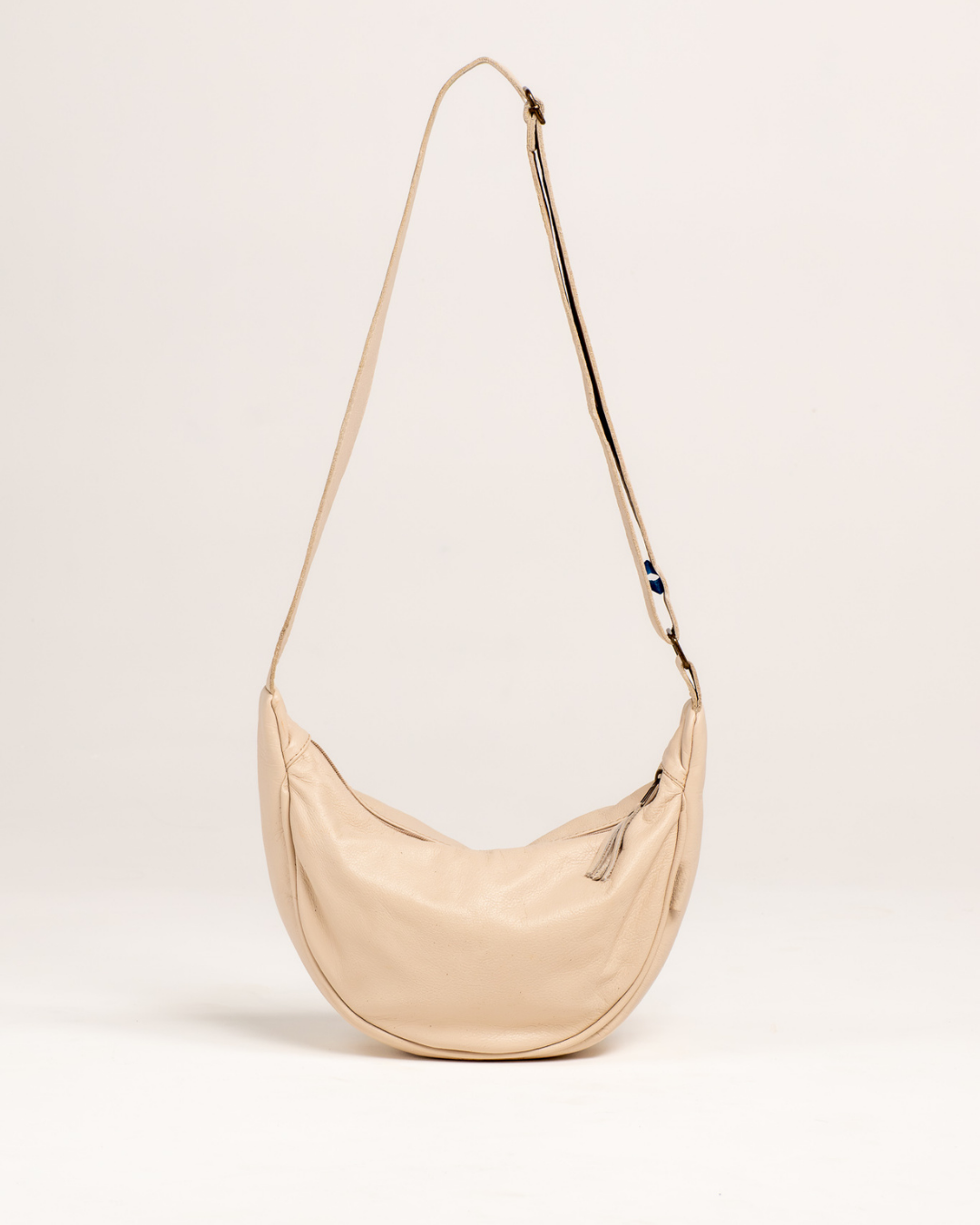 Ngozi Collection cream leather crescent crossbody bag
