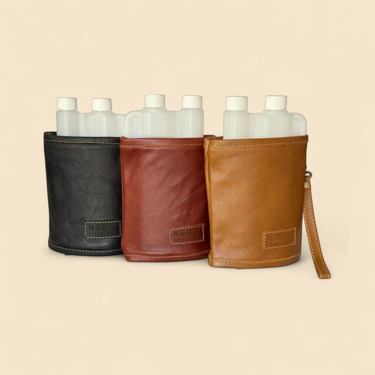 Ngozi Collection leather tot bottle covers in black, rust and tan