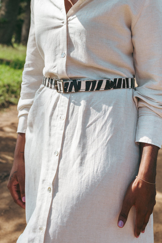 Ngozi Collection zebra print hide ladies belt worn over a linen skirt