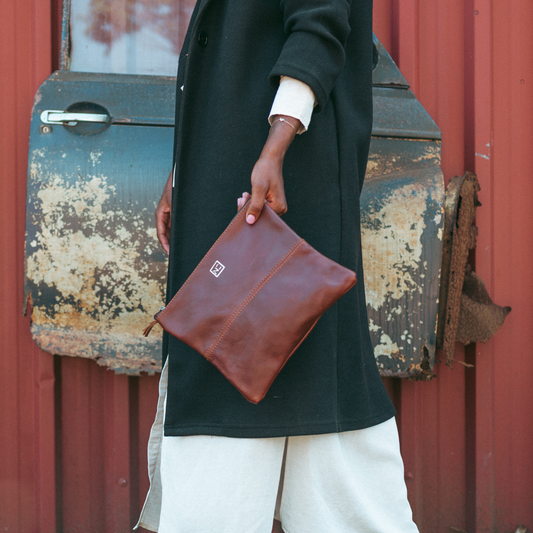 Ngozi Collection chocolate leather ladies organiser held in hand