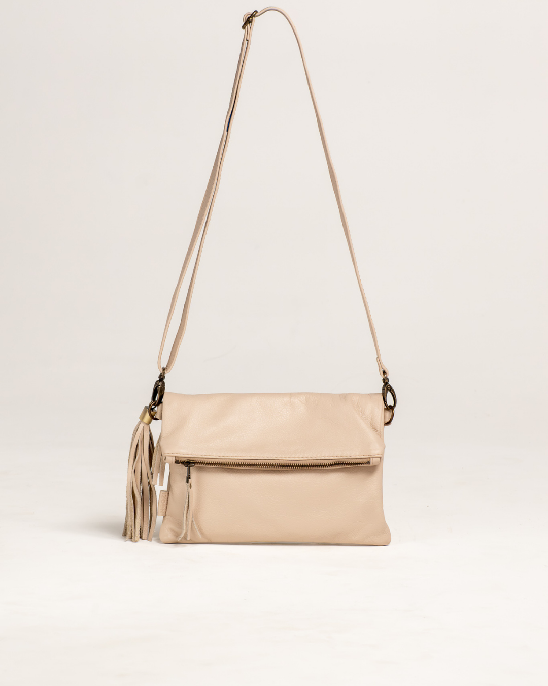 Ngozi Collection latte leather clutch and sling bag