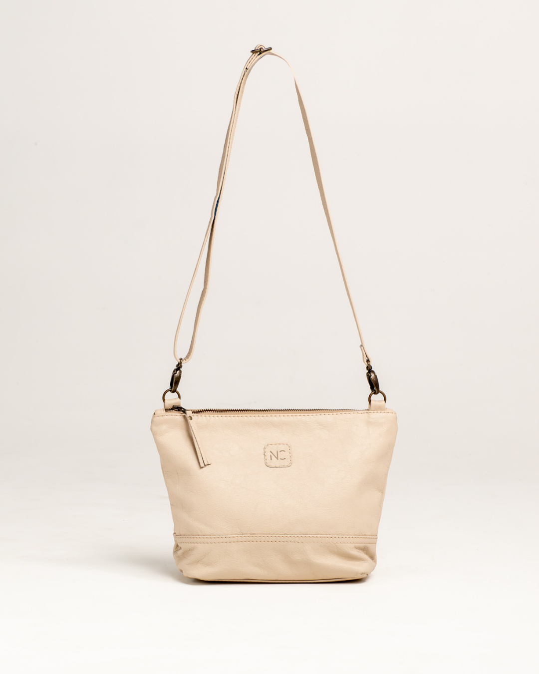 Ngozi Collection latte leather sling bag