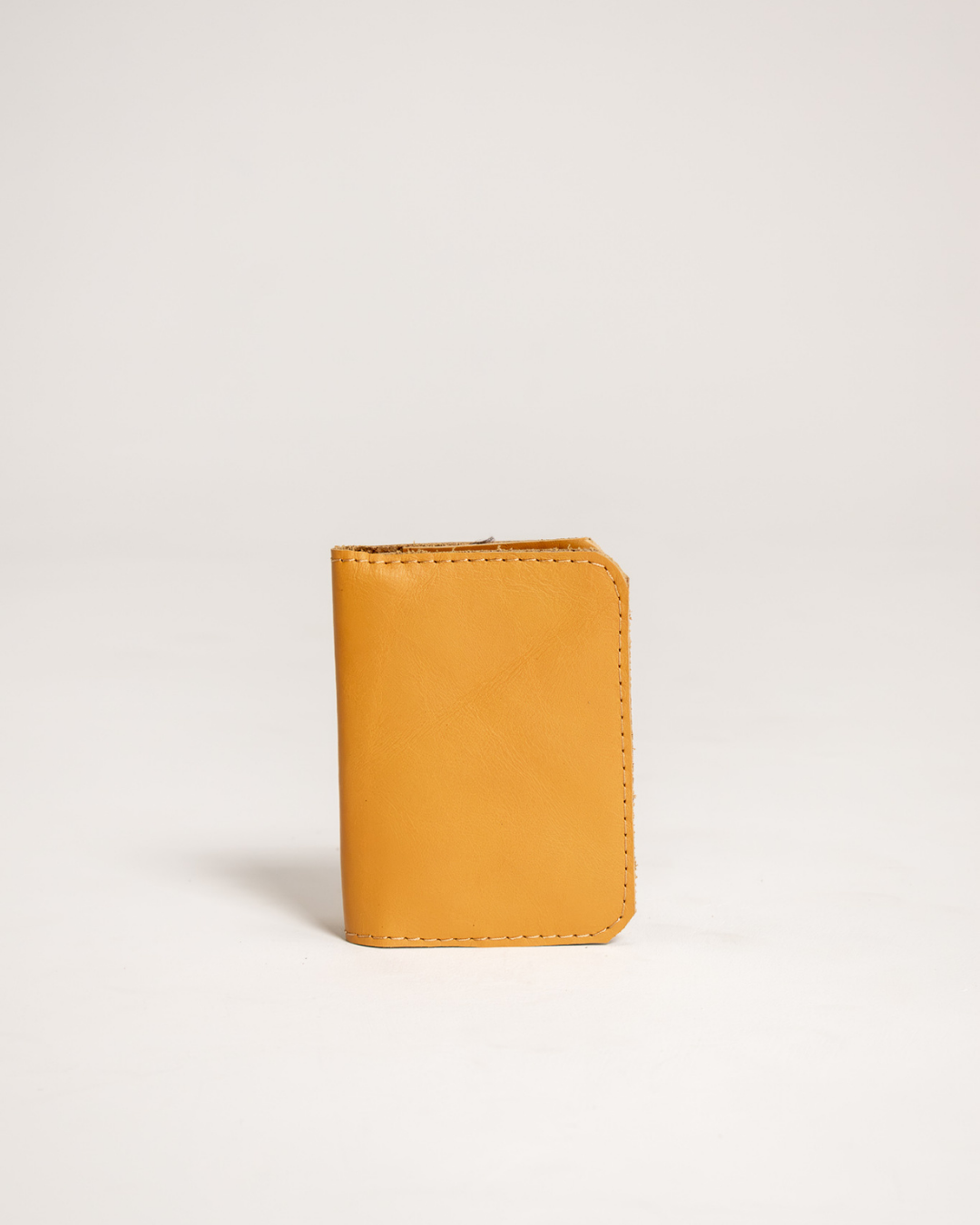 Ngozi Collection mustard leather passport cover