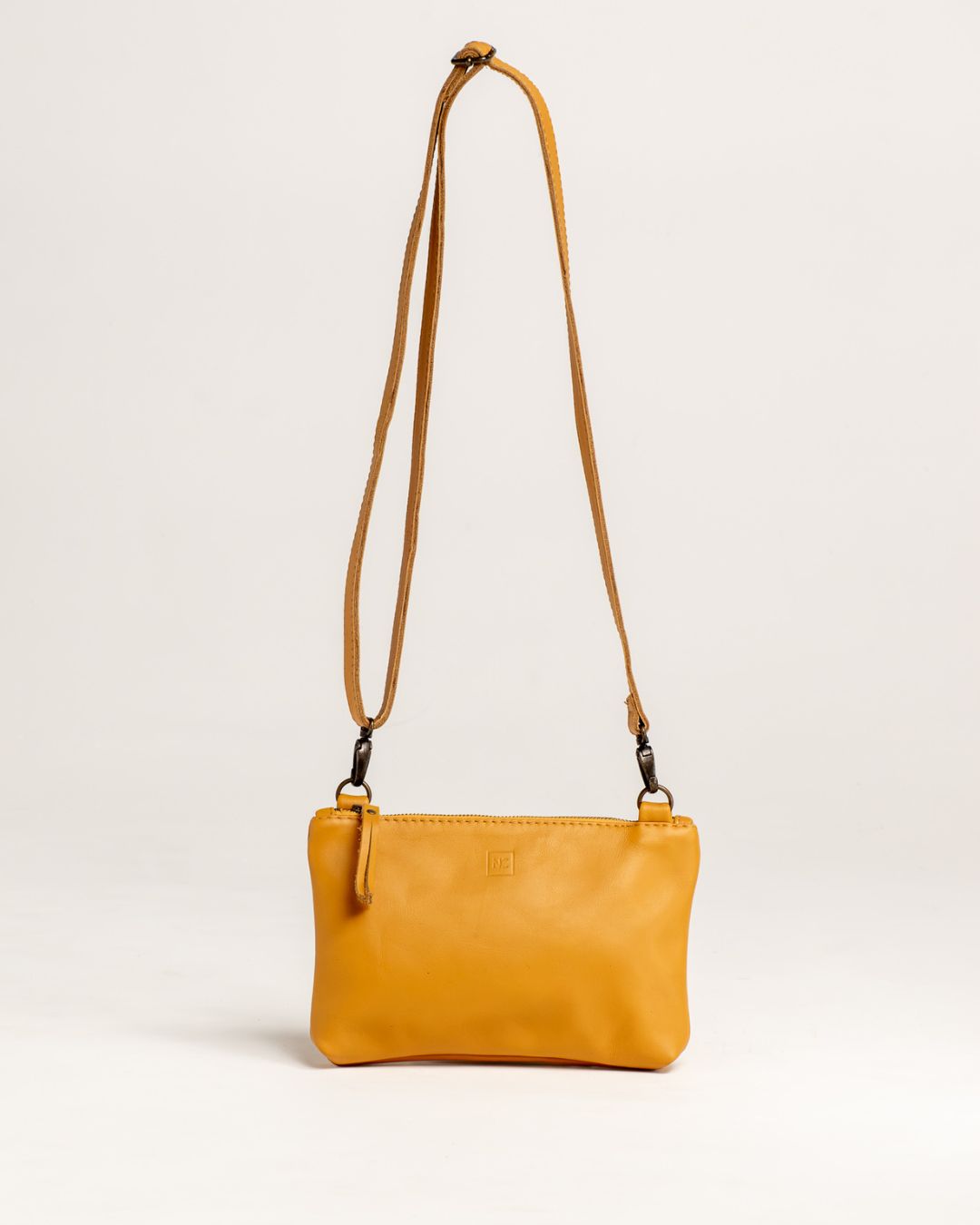 Ngozi Collection mustard leather sling bag with adjustable strap