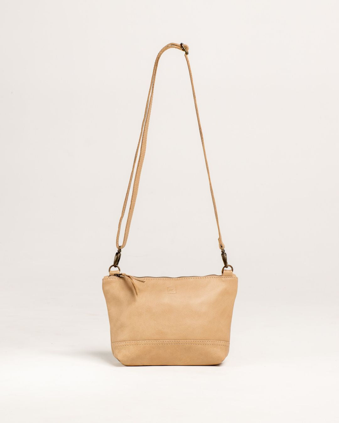 Ngozi Collection oat leather sling bag with adjustable strap