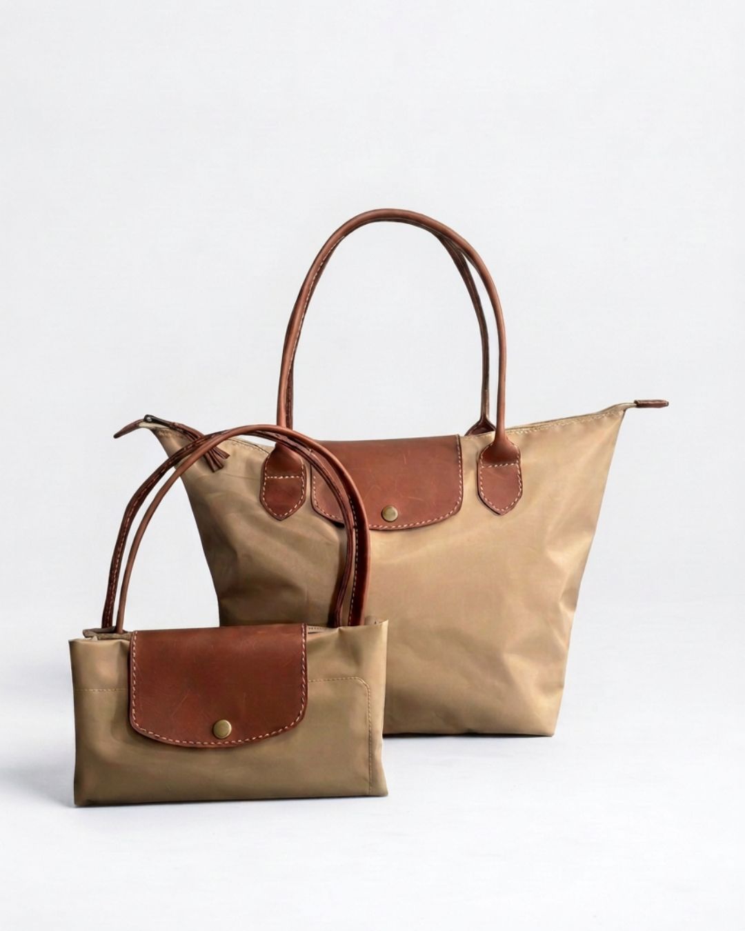 Ngozi Collection oat nylon foldable shopper tote shown folded and open