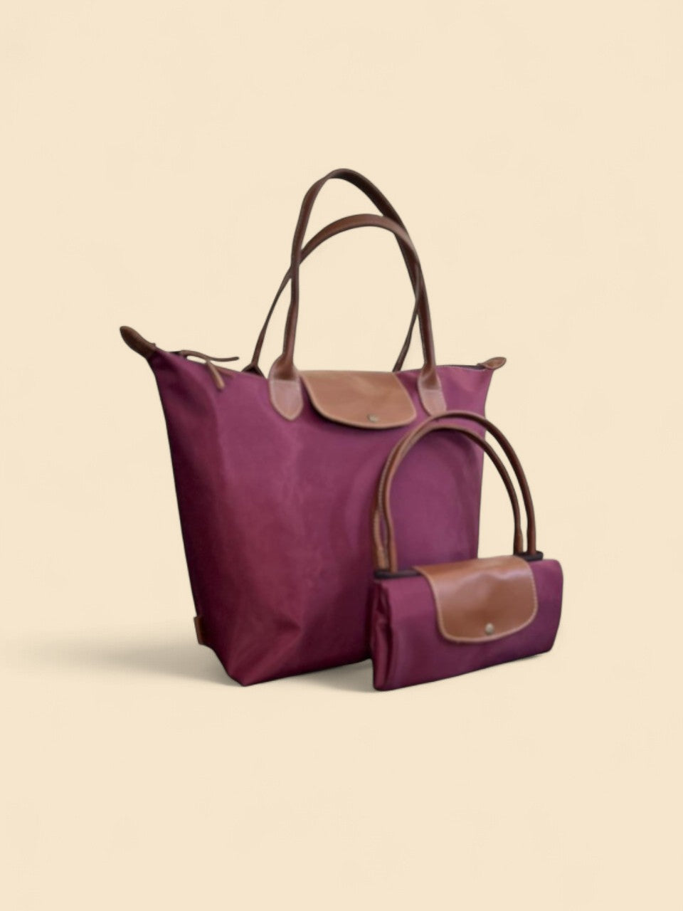 Ngozi Collection plum nylon foldable shopper tote shown folded and open