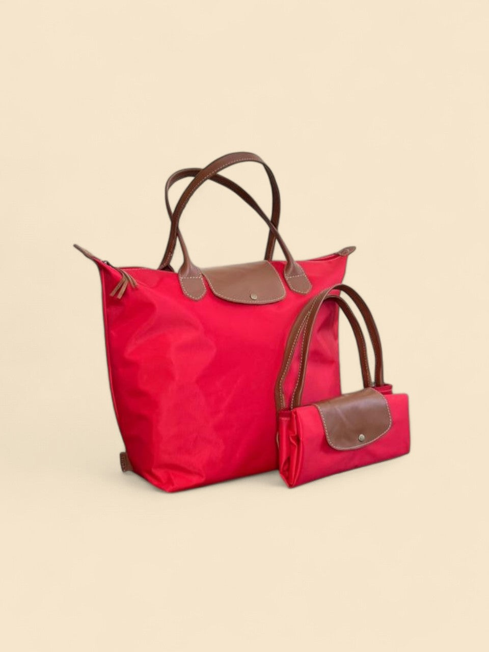 Ngozi Collection red nylon foldable shopper tote shown folded and open