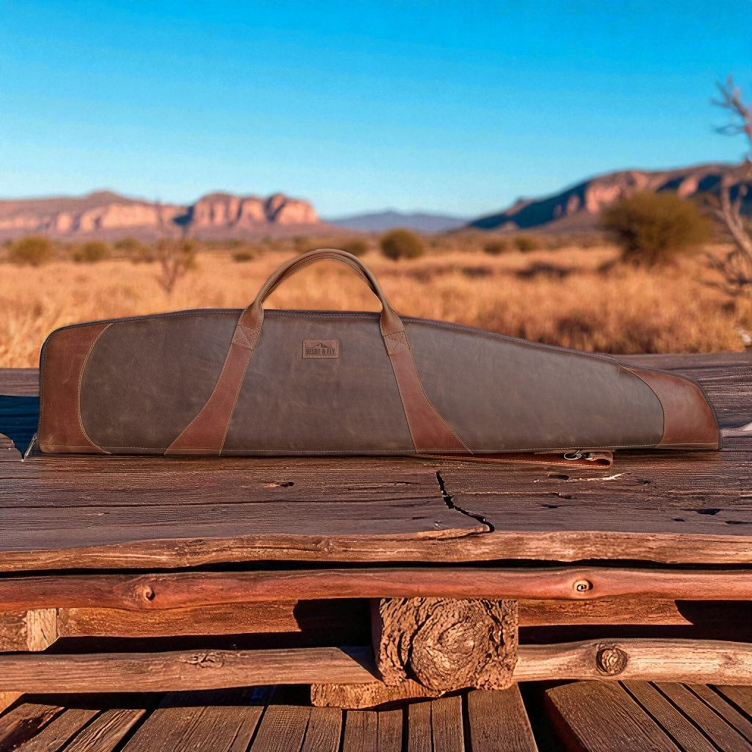 Ngozi Collection two-tone leather rifle bag on a wooden bench outdoors