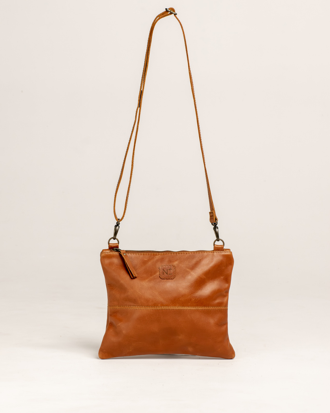 Ngozi Collection tan leather crossbody bag