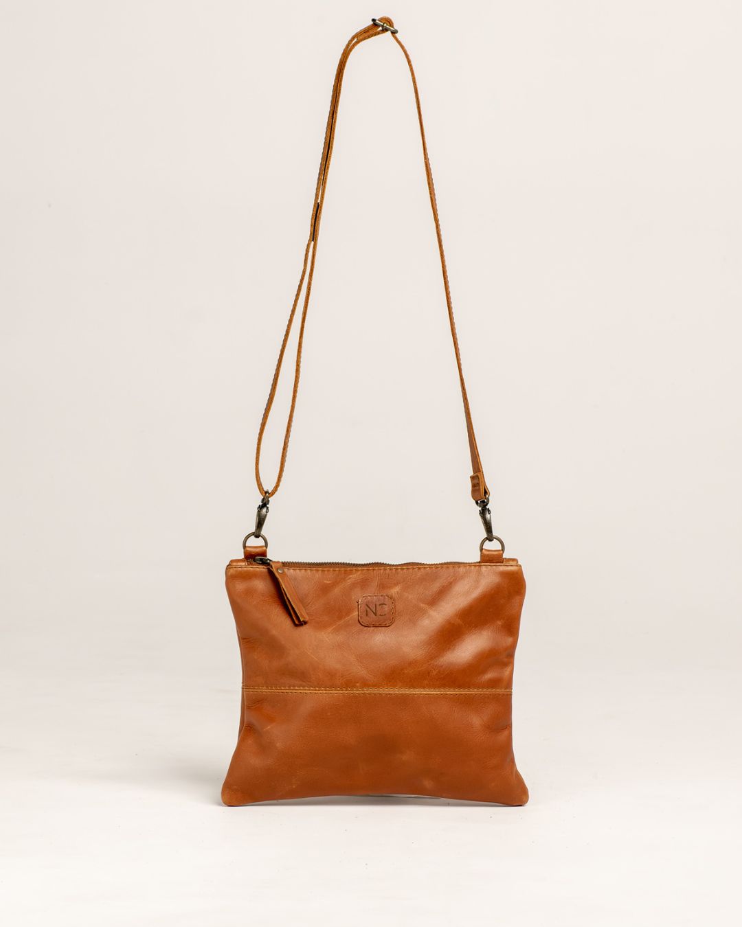 Ngozi Collection tan leather crossbody bag with adjustable strap