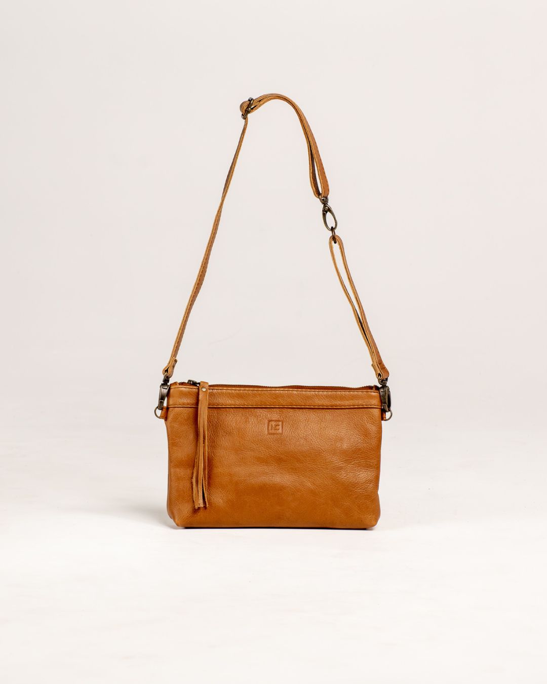 Ngozi Collection tan leather hip bag with adjustable strap