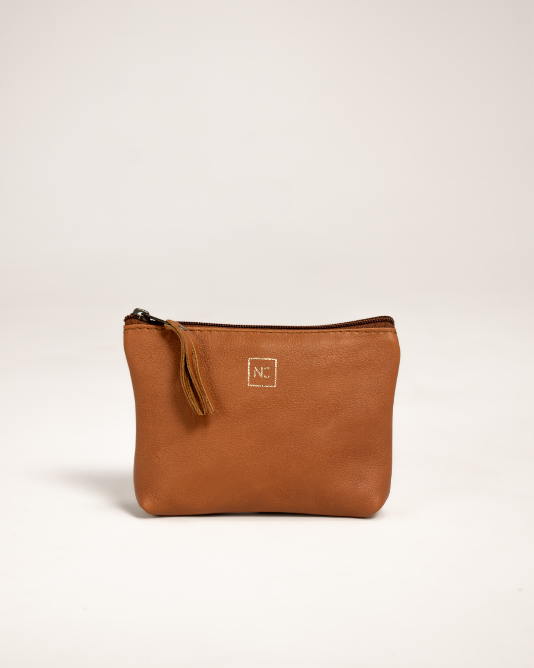 Ngozi Collection tan leather pouch with zipper pull