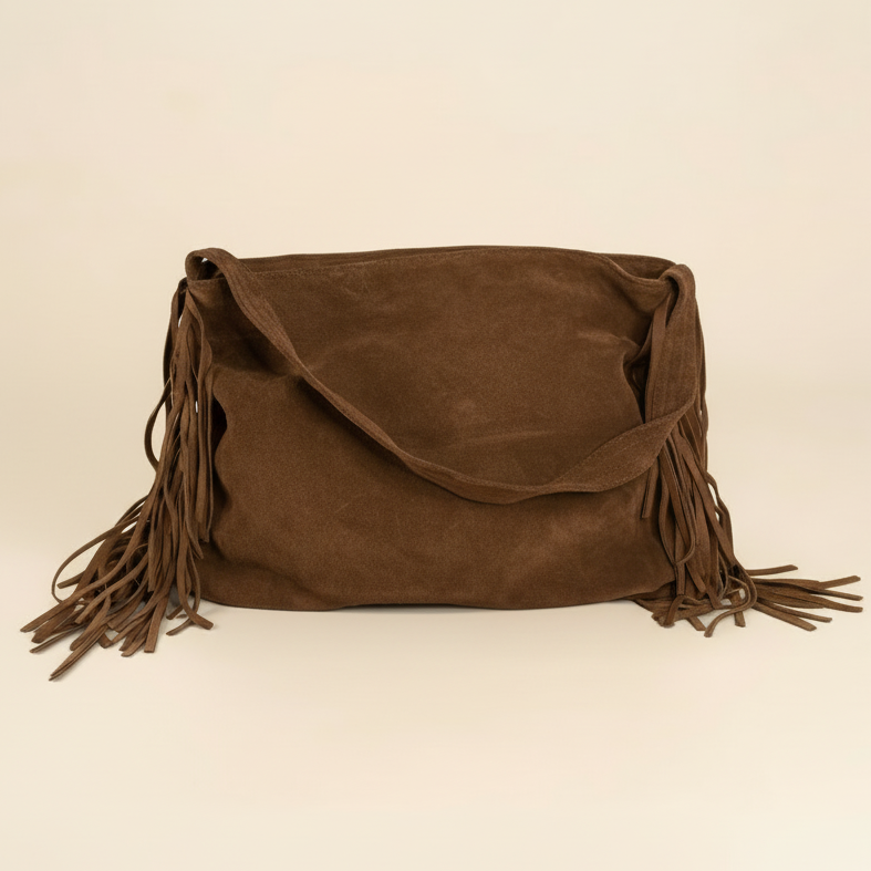 chocolate suede handbag with fringes on a beige background